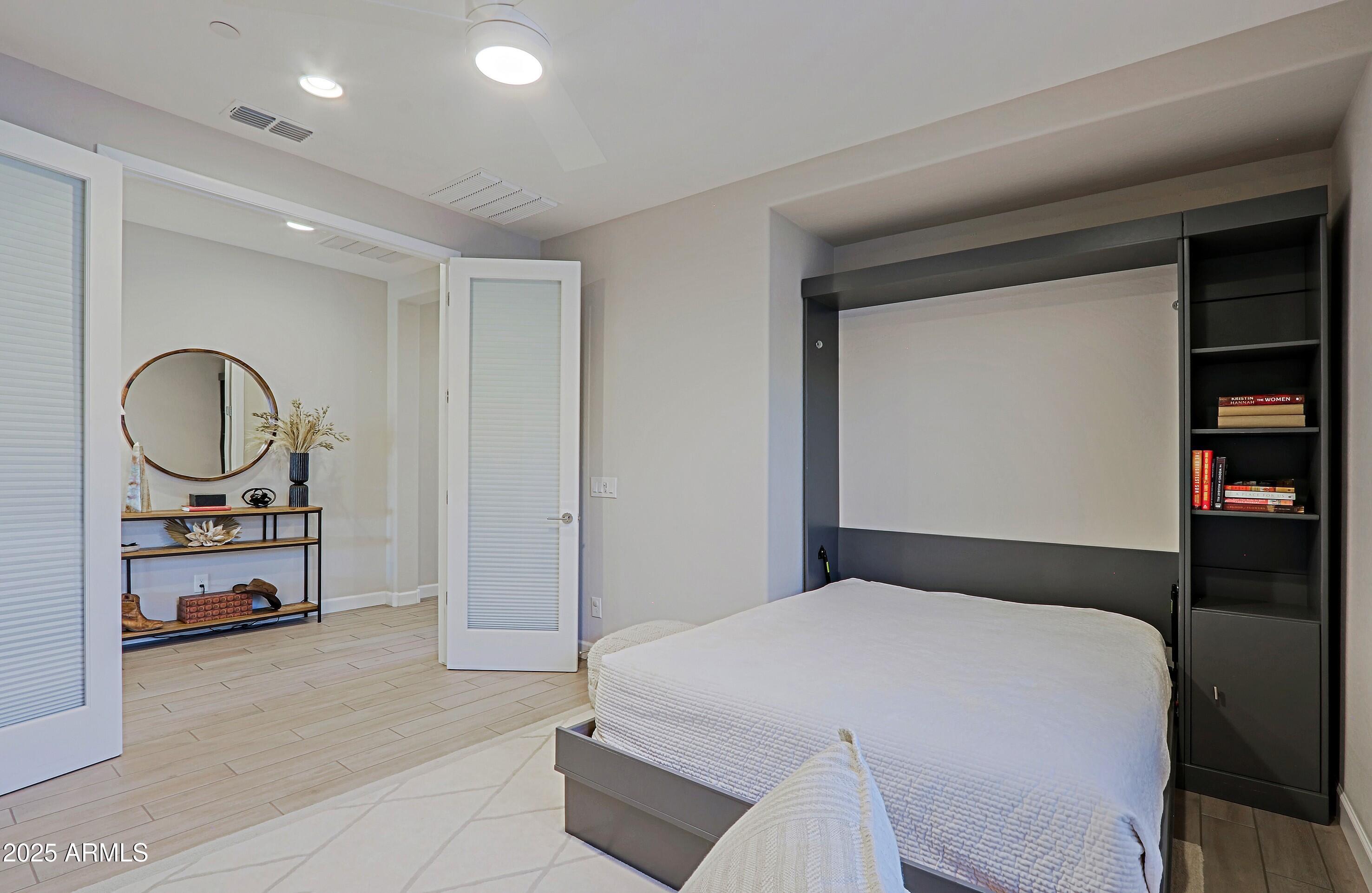 17811 East Cindercone Road Rio Verde, AZ 85263 - Photo 12 of 32 a bedroom with bed and a large mirror