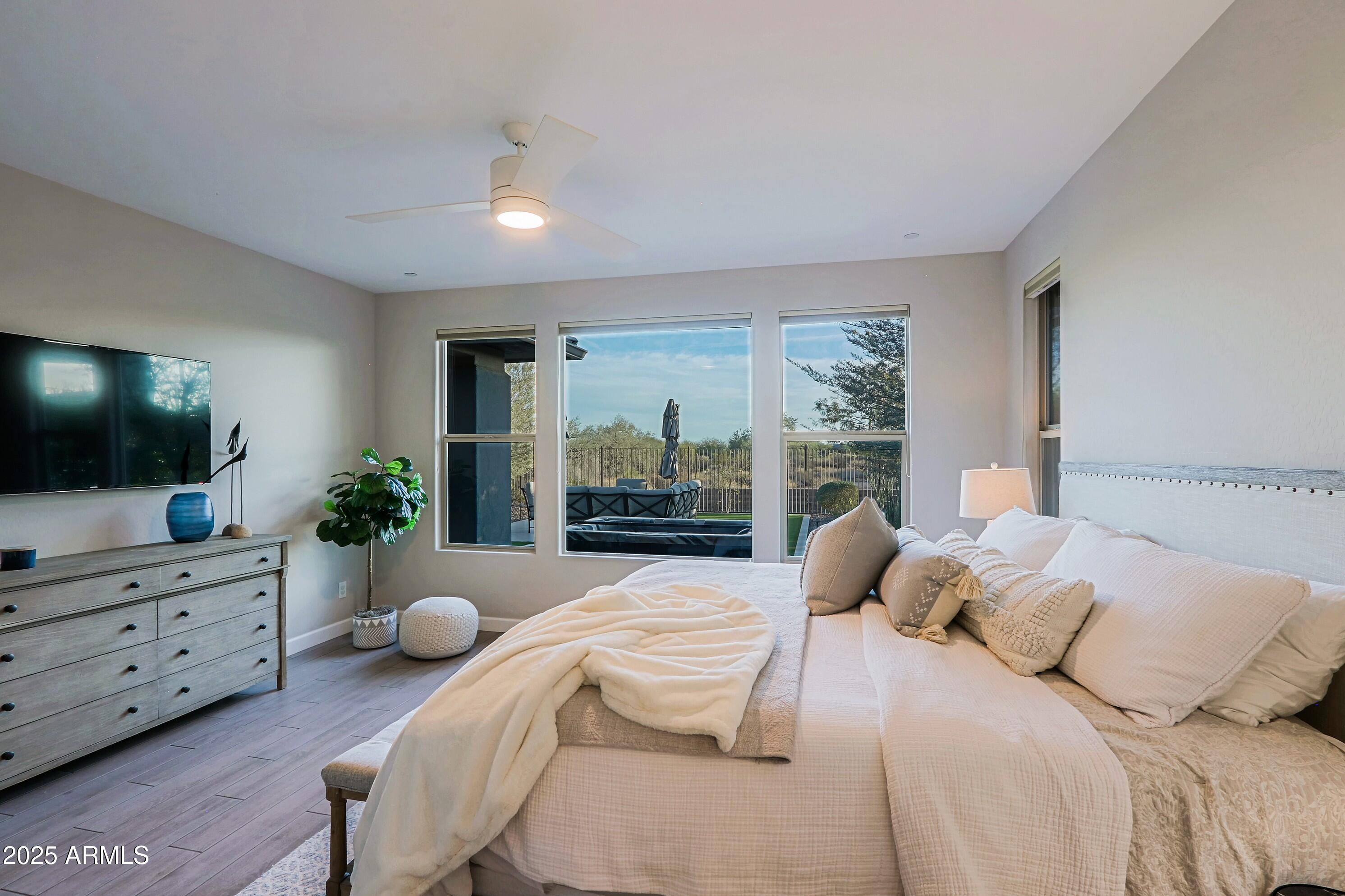 17811 East Cindercone Road Rio Verde, AZ 85263 - Photo 14 of 32 a bedroom with a bed and flat screen tv