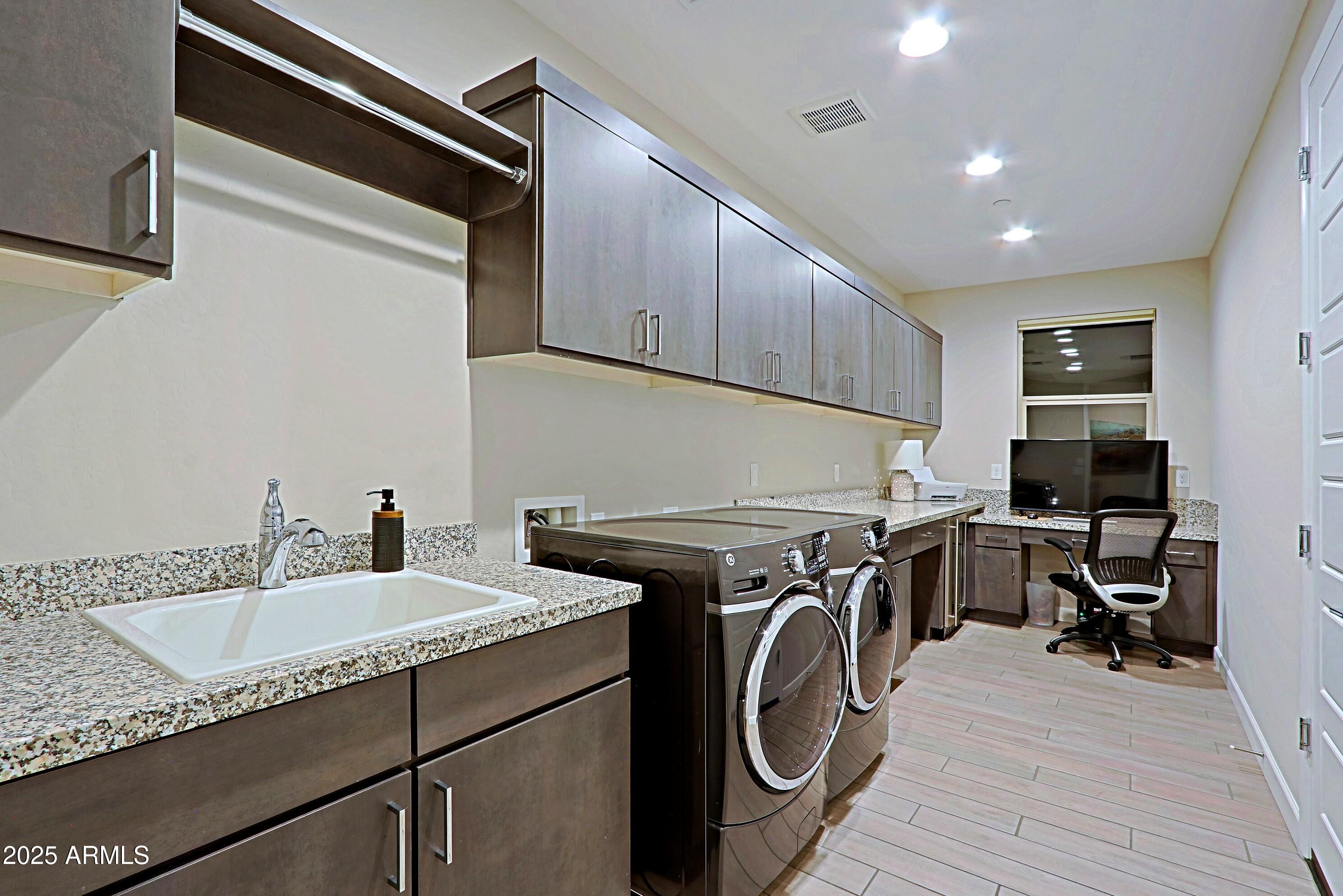 17811 East Cindercone Road Rio Verde, AZ 85263 - Photo 19 of 32 a utility room with sink dryer and washer