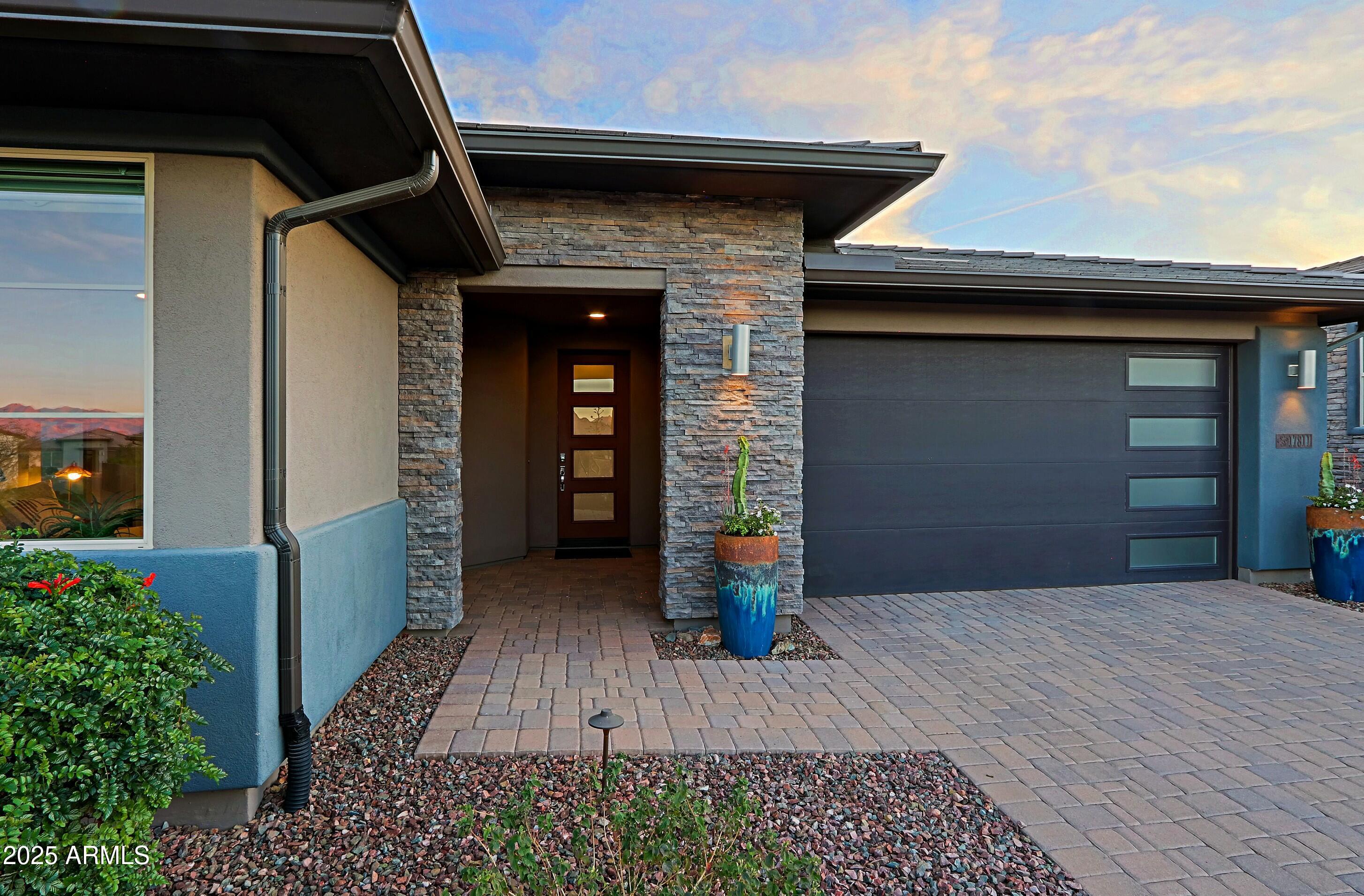 17811 East Cindercone Road Rio Verde, AZ 85263 - Photo 2 of 32 a front view of a house with a yard