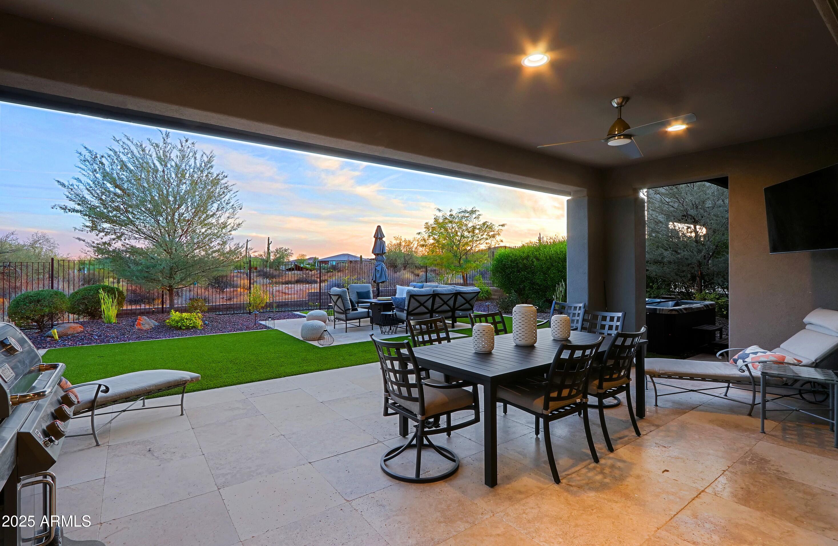 17811 East Cindercone Road Rio Verde, AZ 85263 - Photo 23 of 32 a view of a porch with chairs and backyard