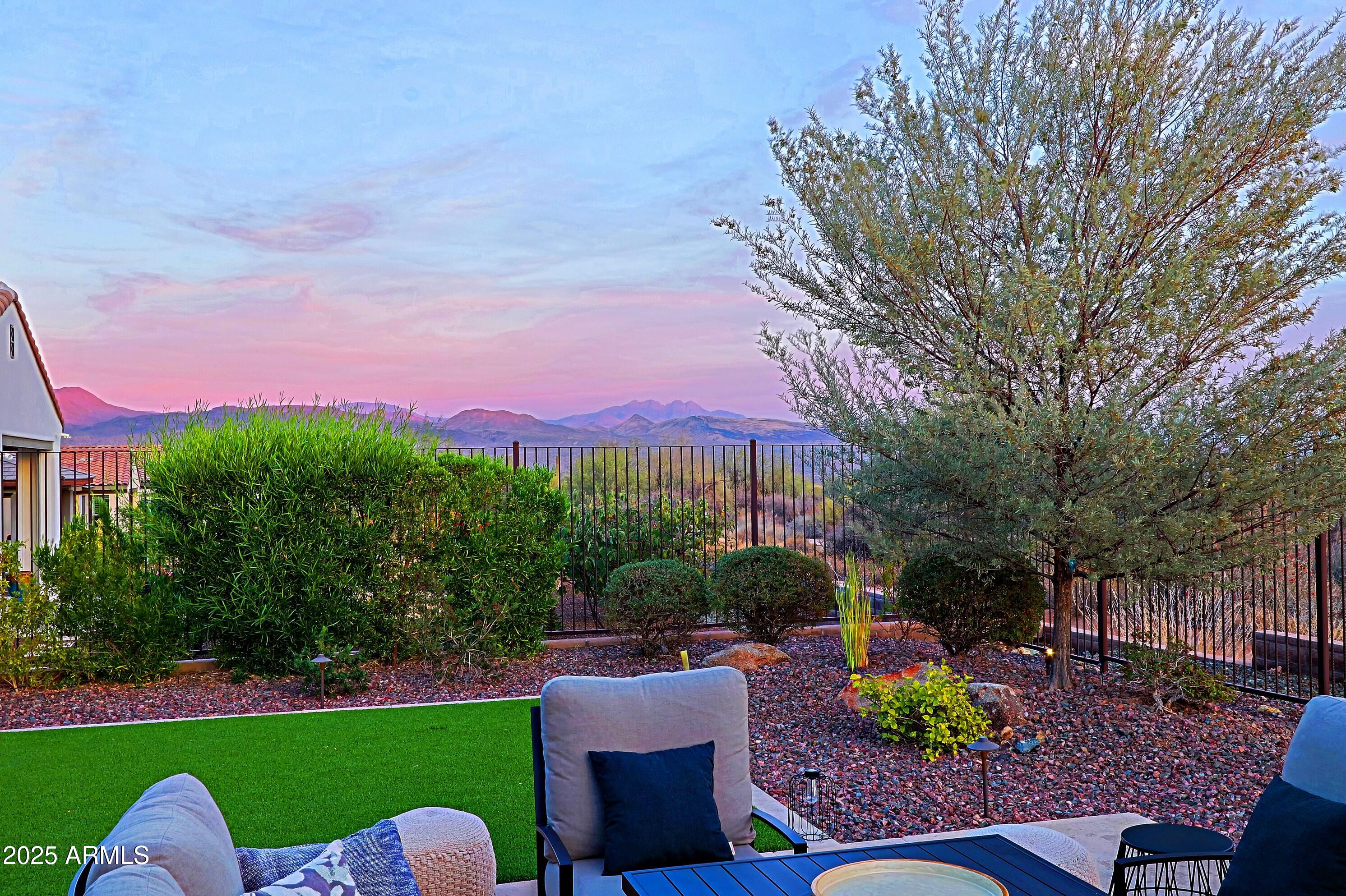 17811 East Cindercone Road Rio Verde, AZ 85263 - Photo 24 of 32 a view of a chairs and table in the backyard