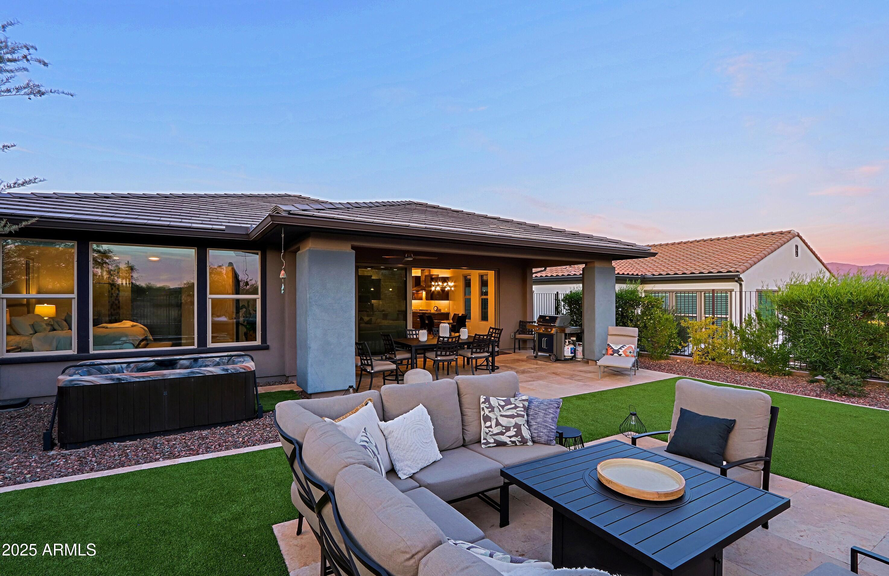 17811 East Cindercone Road Rio Verde, AZ 85263 - Photo 25 of 32 a view of an house with backyard furniture and a garden