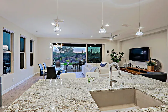 a living room with fireplace furniture and a flat screen tv