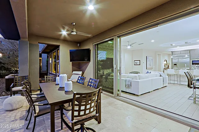 a dining room with furniture and window