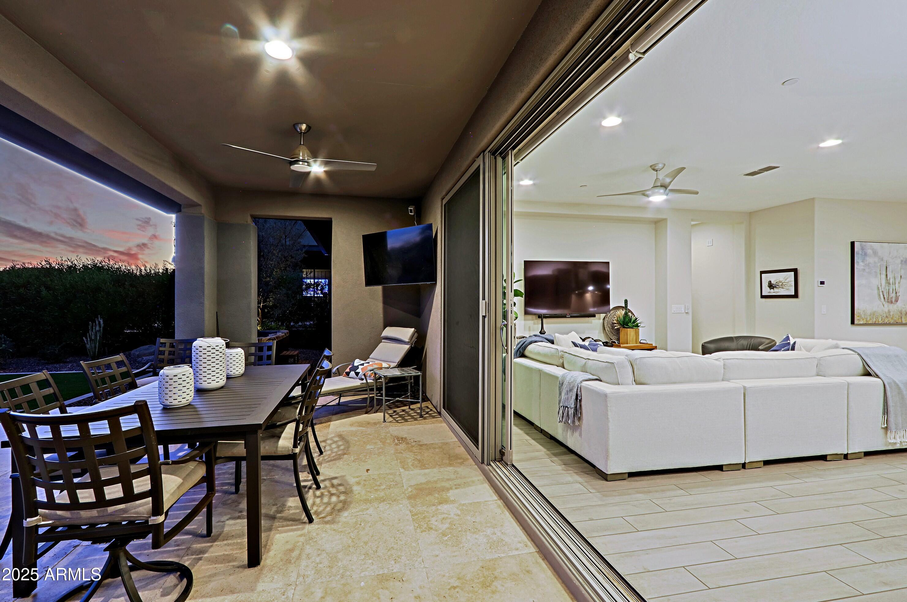 17811 East Cindercone Road Rio Verde, AZ 85263 - Photo 10 of 32 a living room with furniture and a flat screen tv