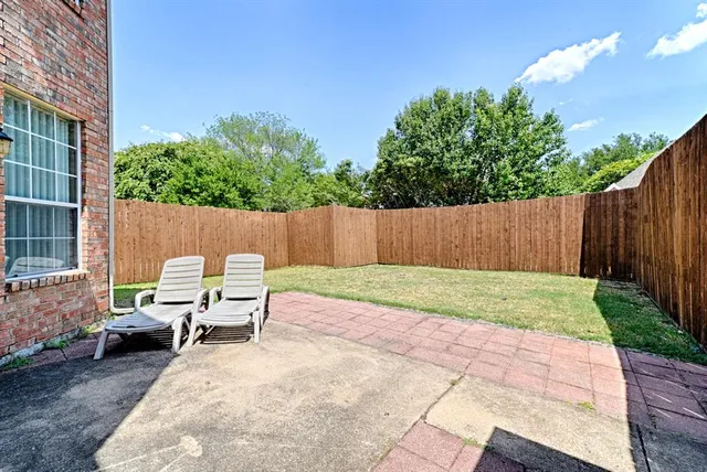 a view of backyard with seating space