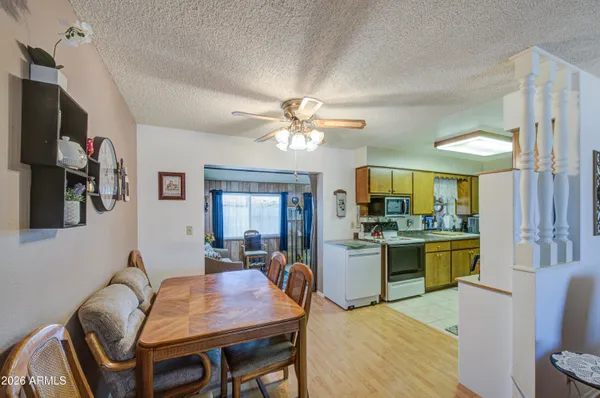 a dining room with furniture and window