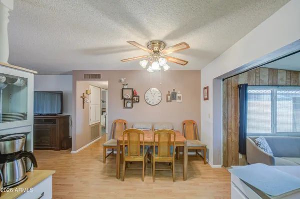 a view of a dining room with furniture and wooden floor