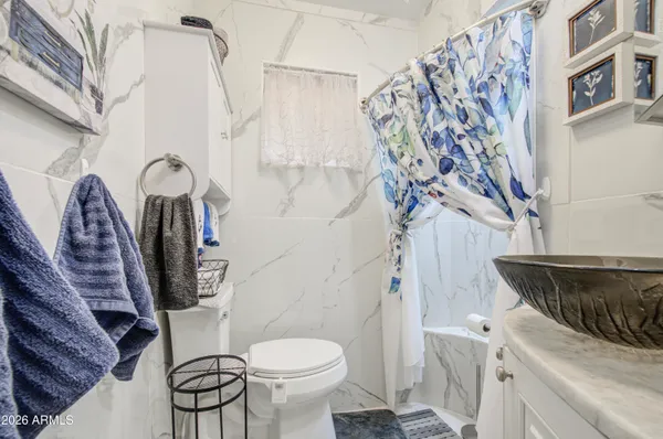 a bathroom with a toilet and a sink