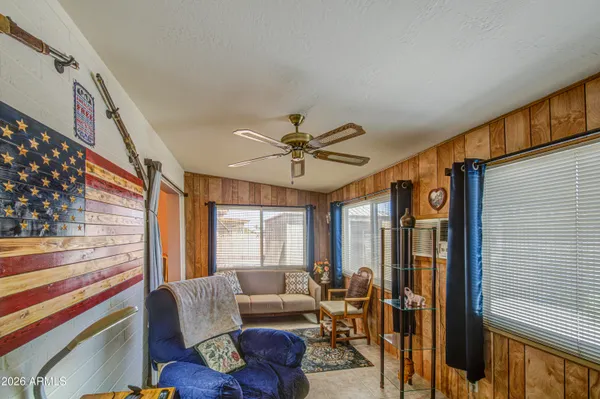 a living room with furniture and a window