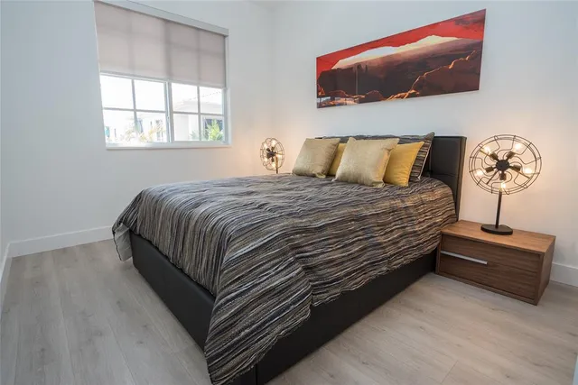 a bedroom with a bed and window