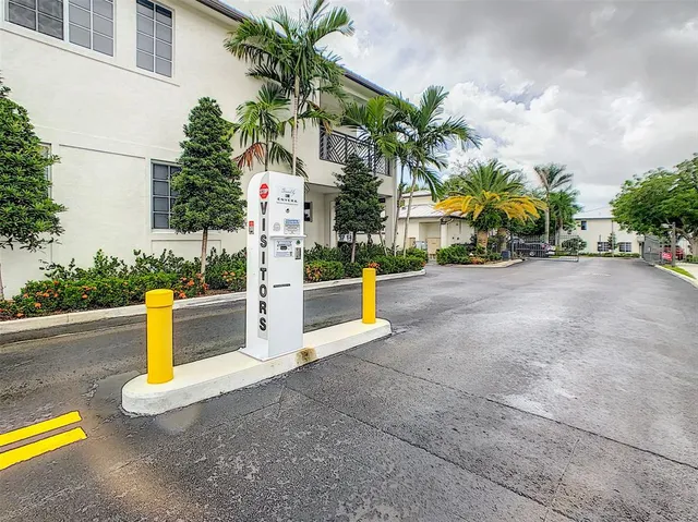 a view of a house with swimming pool and sitting area