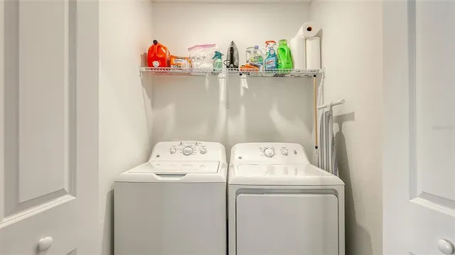 a aerial view of a house with garden space and street view