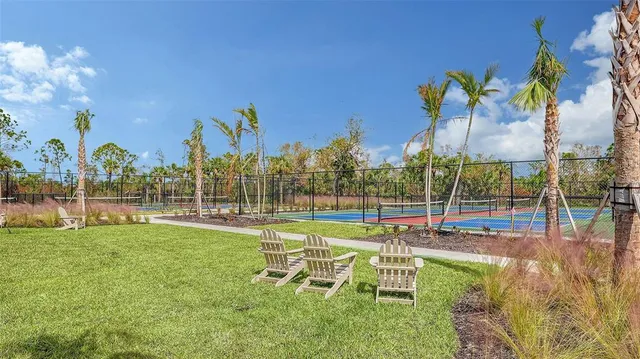 a building outdoor space with patio furniture and potted plants