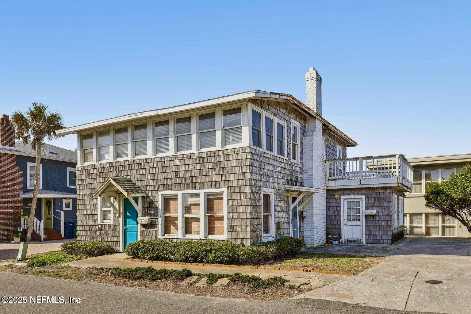 1408 Strand Street Neptune Beach, FL 32266 - Photo 2 of 3 a front view of a house