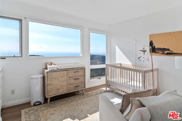 a view of a livingroom with furniture and windows