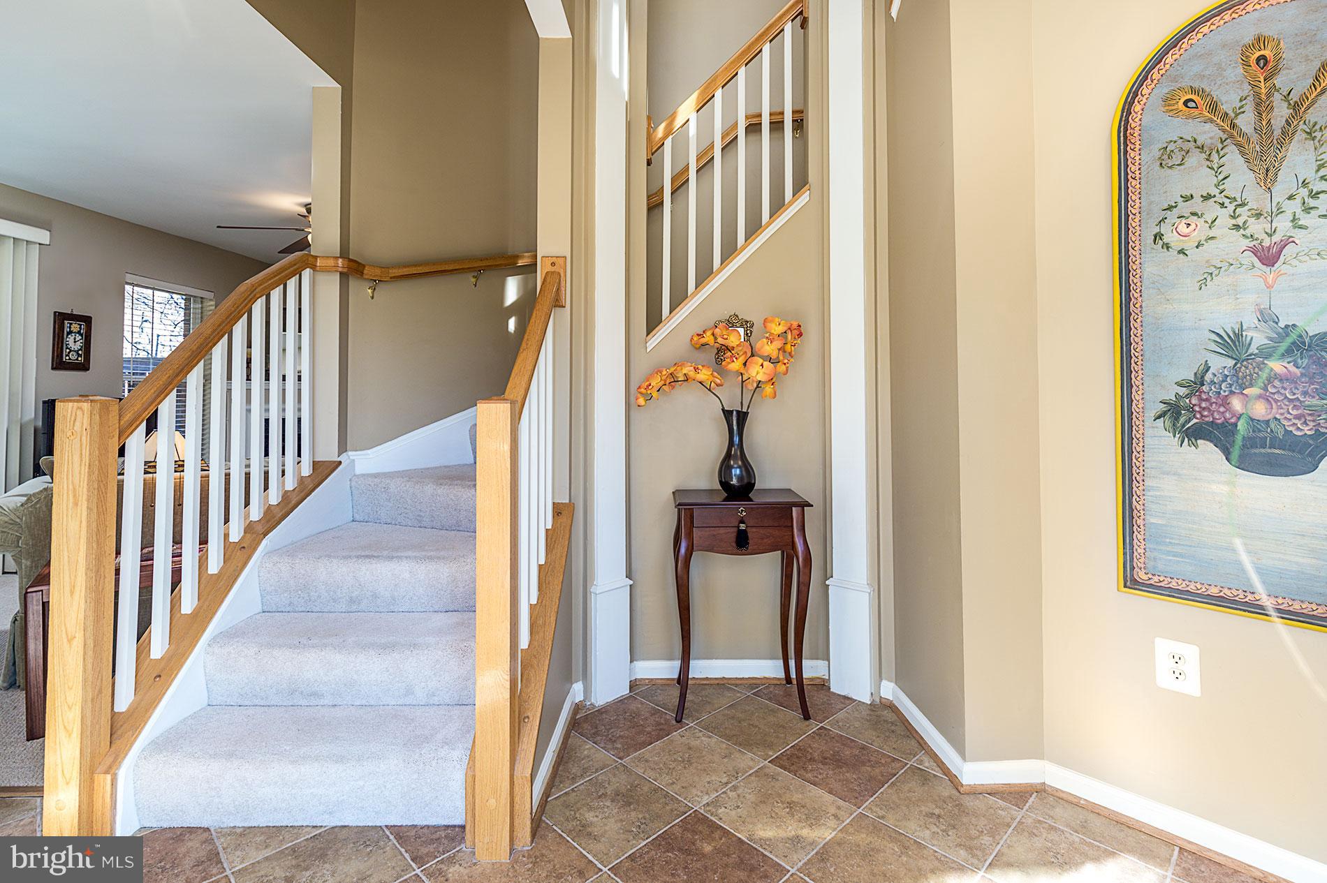 11522 Waterhaven Court Reston, VA 20190 - Photo 3 of 28 ANGLED STAIRCASE IN FOYER