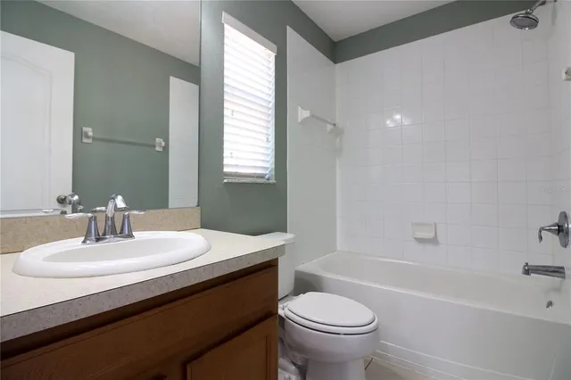 a bathroom with a sink a toilet and a bathtub