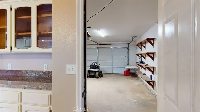 a view of hallway with wooden floor