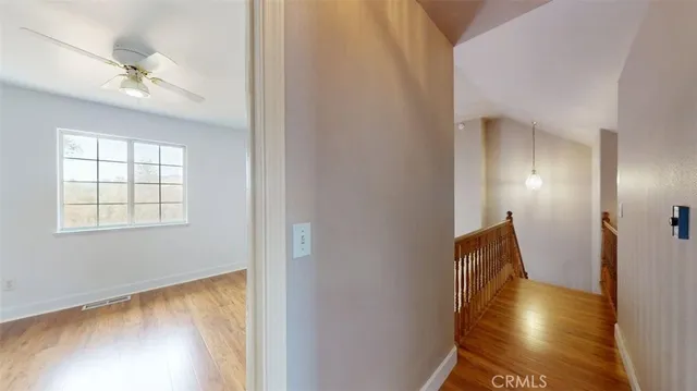 a front view of a house with a yard covered with snow