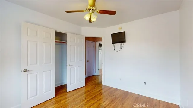 a front view of a house with trees