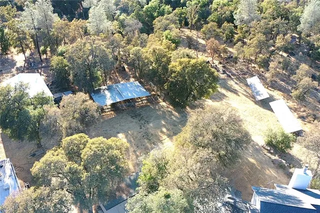 a backyard of a house with lots of green space and fog