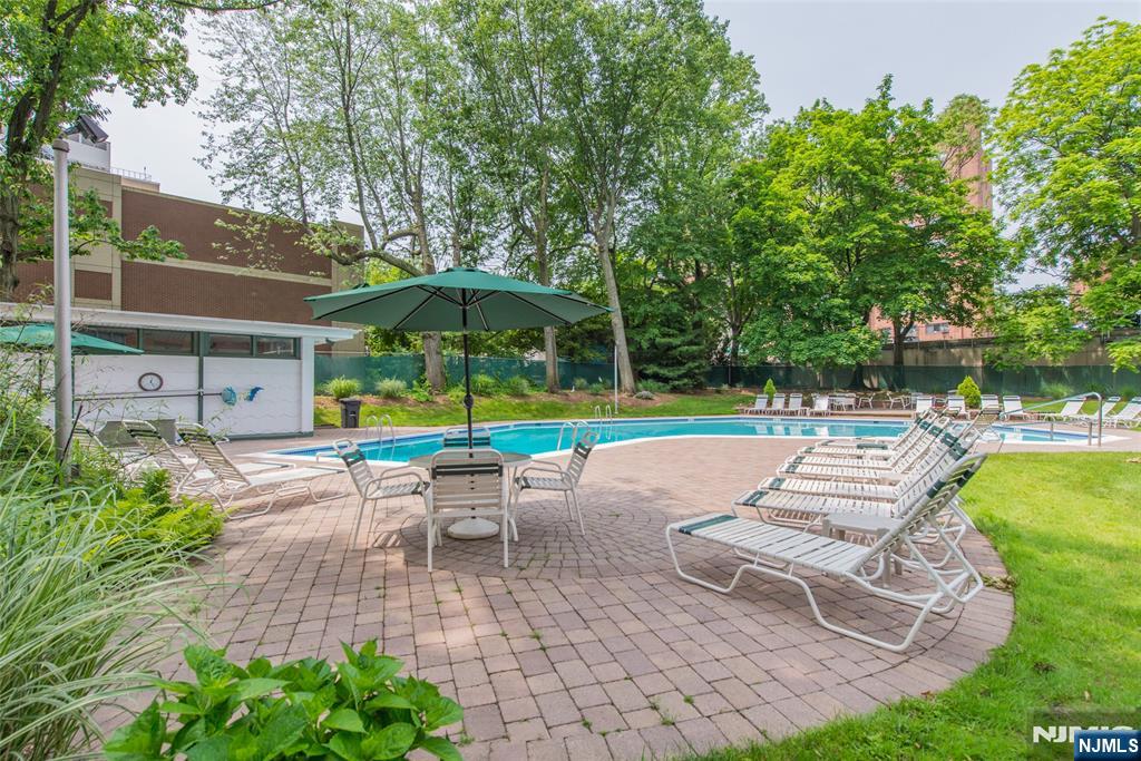 301 Beech Street, Unit 3K Hackensack, NJ 07601 - Photo 13 of 29 a view of a swimming pool with a patio