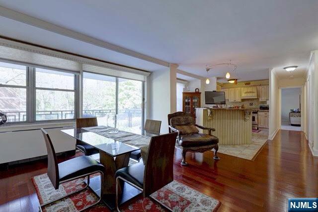 301 Beech Street, Unit 3K Hackensack, NJ 07601 - Photo 20 of 29 a view of a dining room with furniture and wooden floor