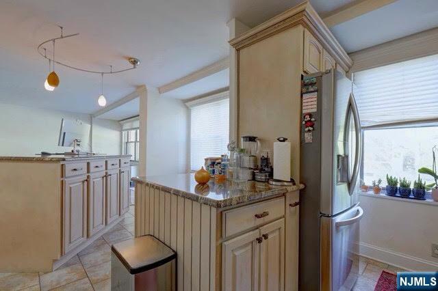 301 Beech Street, Unit 3K Hackensack, NJ 07601 - Photo 23 of 29 a kitchen that has a lot of cabinets in it