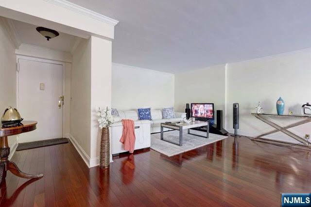 301 Beech Street, Unit 3K Hackensack, NJ 07601 - Photo 25 of 29 a living room with furniture and a wooden floor