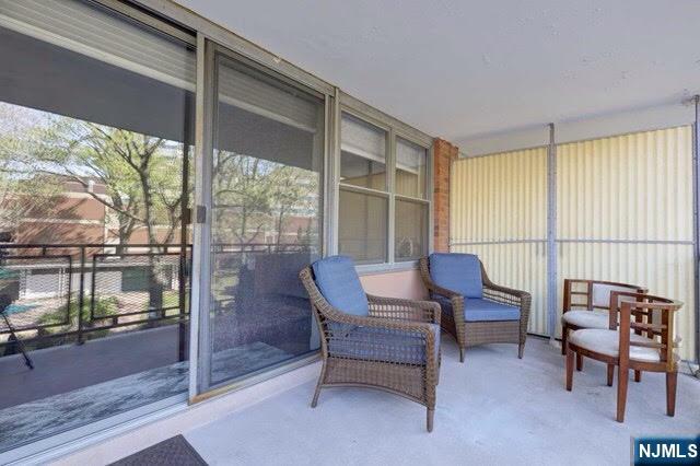301 Beech Street, Unit 3K Hackensack, NJ 07601 - Photo 28 of 29 a view of a workspace with furniture and a window