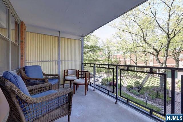 301 Beech Street, Unit 3K Hackensack, NJ 07601 - Photo 29 of 29 a living room with furniture and a gate