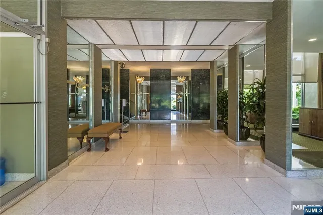 a lobby with furniture and window