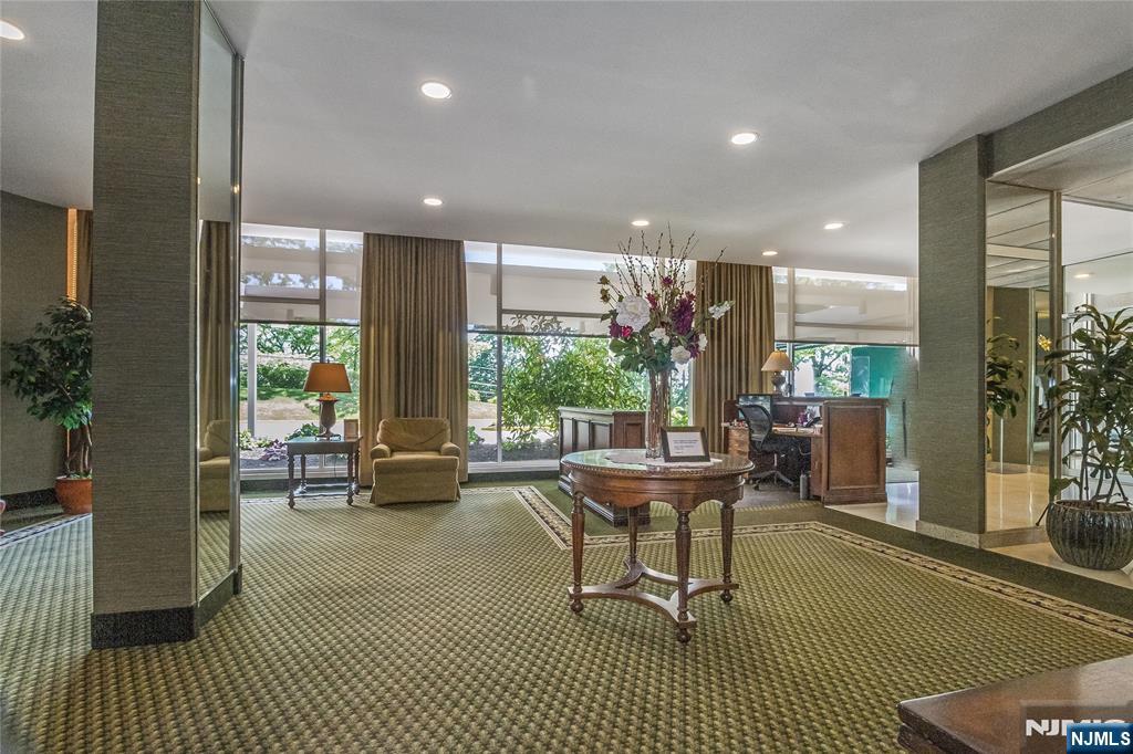301 Beech Street, Unit 3K Hackensack, NJ 07601 - Photo 5 of 29 a living room with furniture and a large window