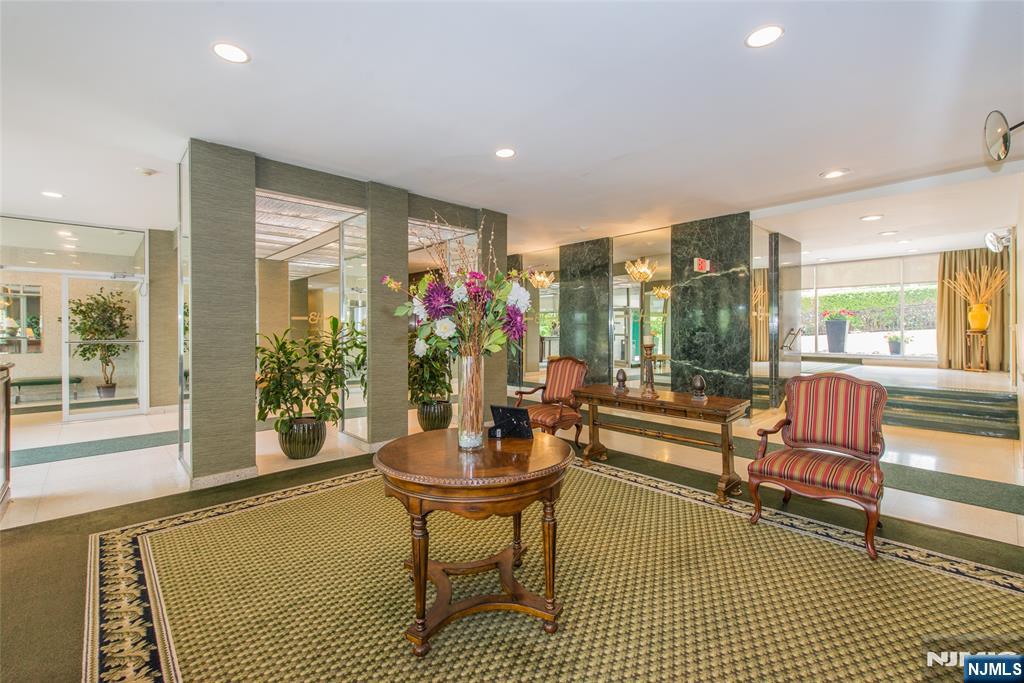 301 Beech Street, Unit 3K Hackensack, NJ 07601 - Photo 8 of 29 a living room with furniture and wooden floor