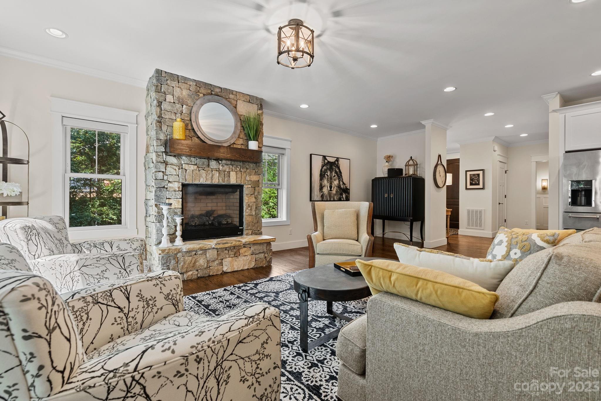 37 Still Creek Loop Fairview, NC 28730 - Photo 13 of 46 a living room with furniture a fireplace and a flat screen tv