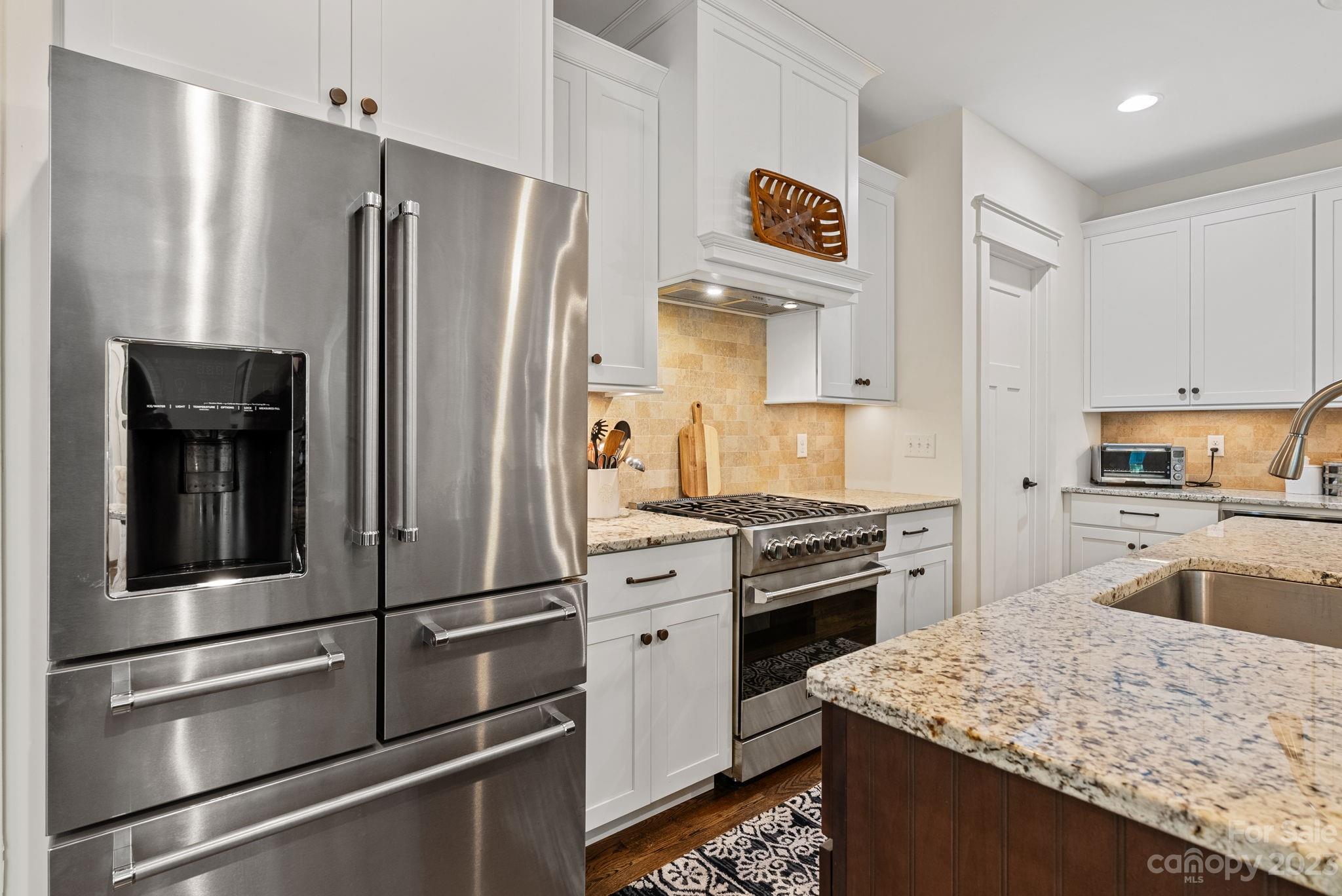 37 Still Creek Loop Fairview, NC 28730 - Photo 15 of 46 a kitchen with granite countertop stainless steel appliances and refrigerator