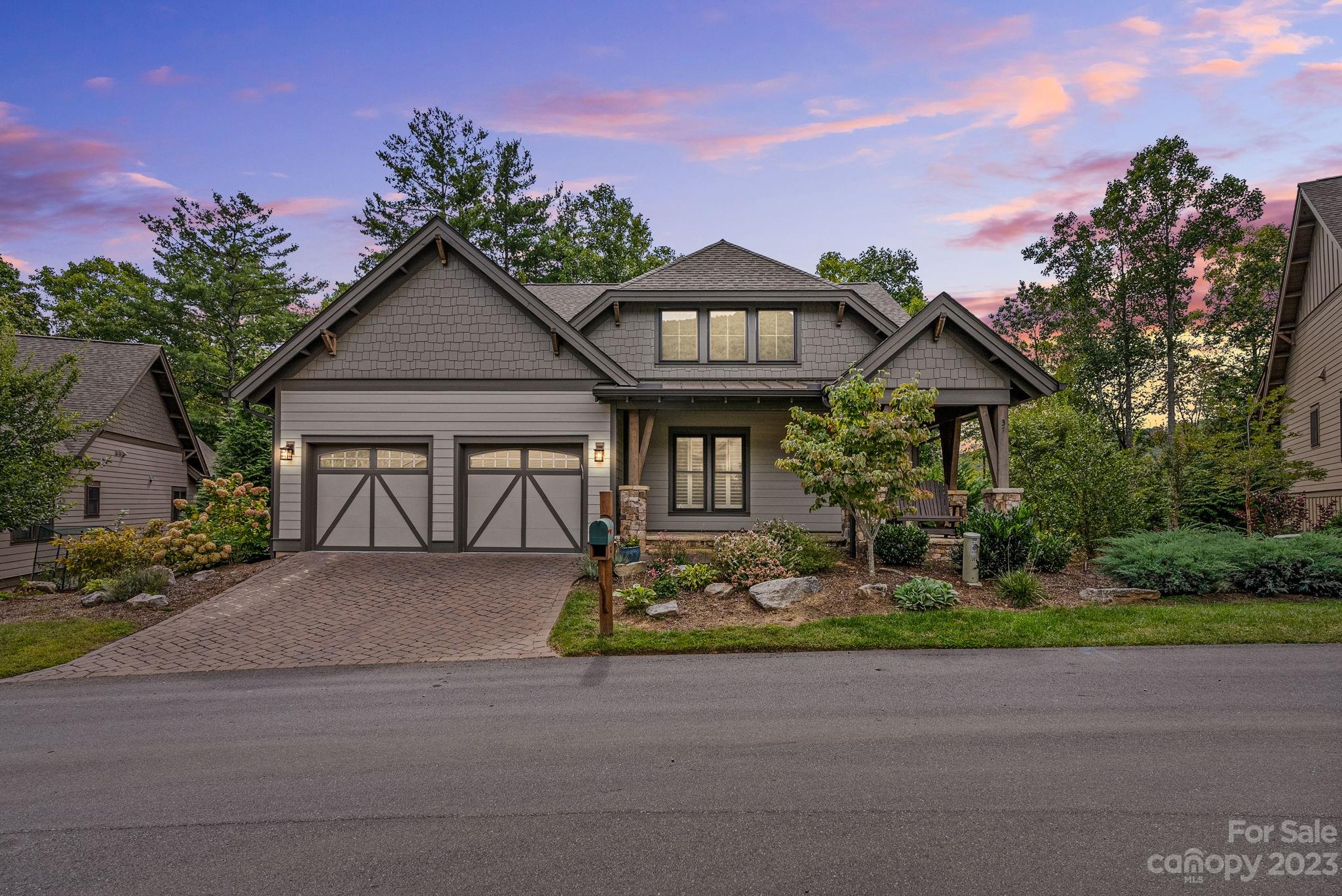 37 Still Creek Loop Fairview, NC 28730 - Photo 2 of 46 a front view of a house with garden
