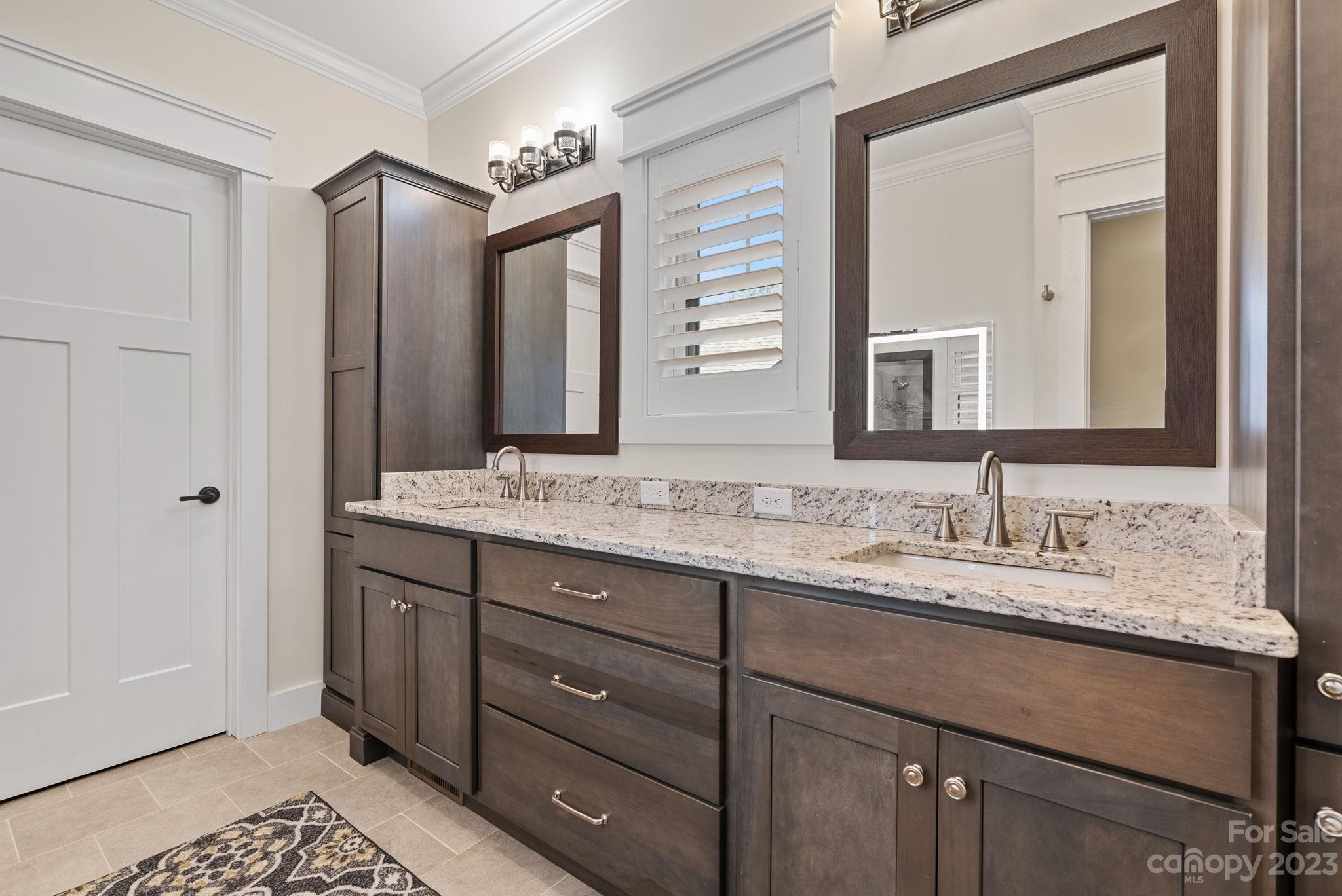 37 Still Creek Loop Fairview, NC 28730 - Photo 22 of 46 a bathroom with a granite countertop sink double and mirror
