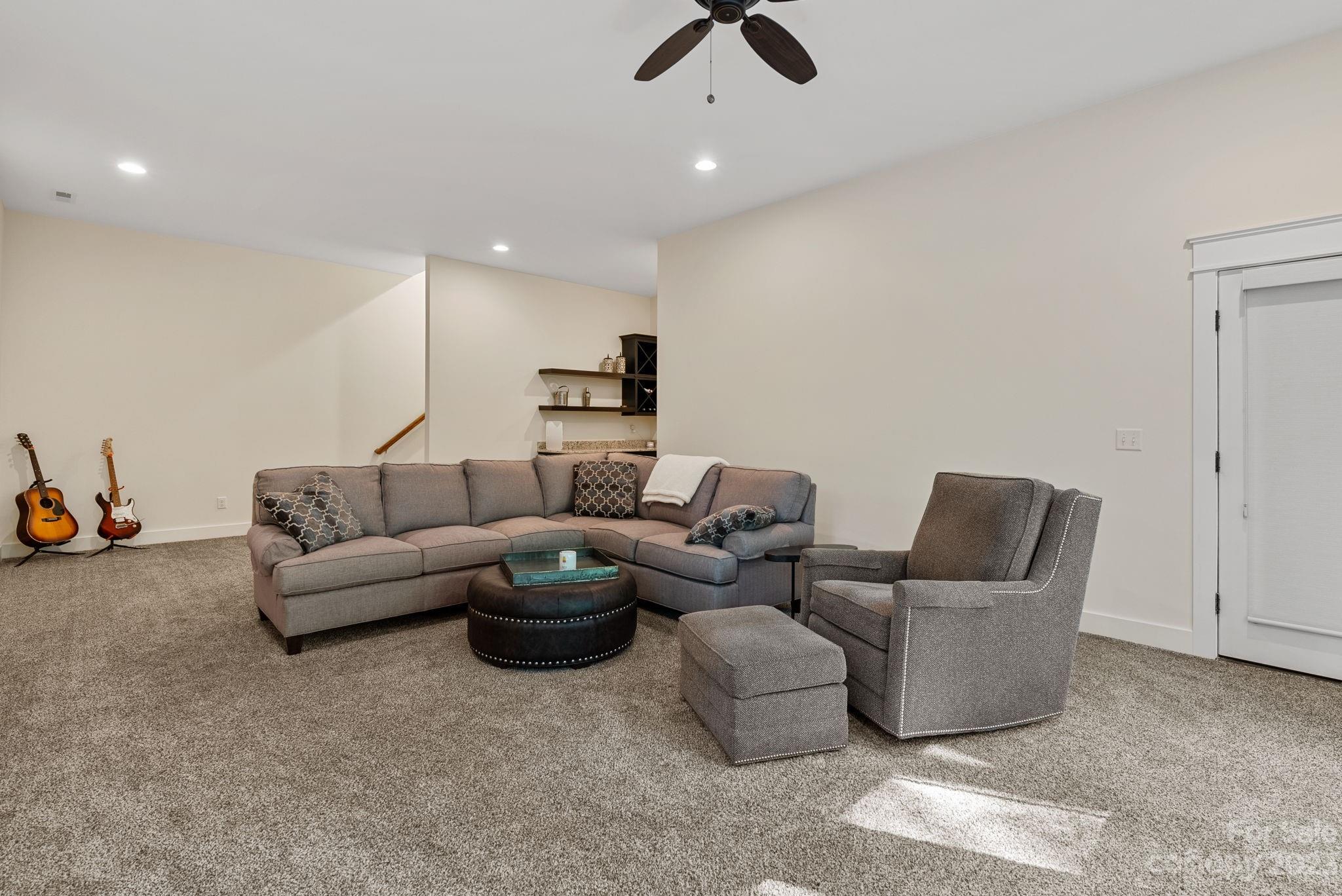 37 Still Creek Loop Fairview, NC 28730 - Photo 23 of 46 a living room with furniture and a ceiling fan