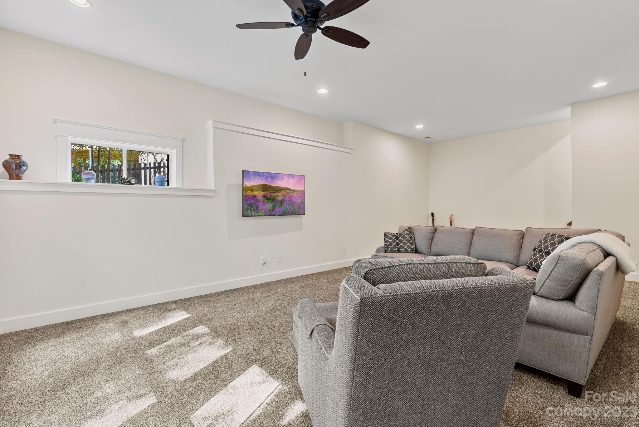 37 Still Creek Loop Fairview, NC 28730 - Photo 25 of 46 a living room with furniture and a ceiling fan
