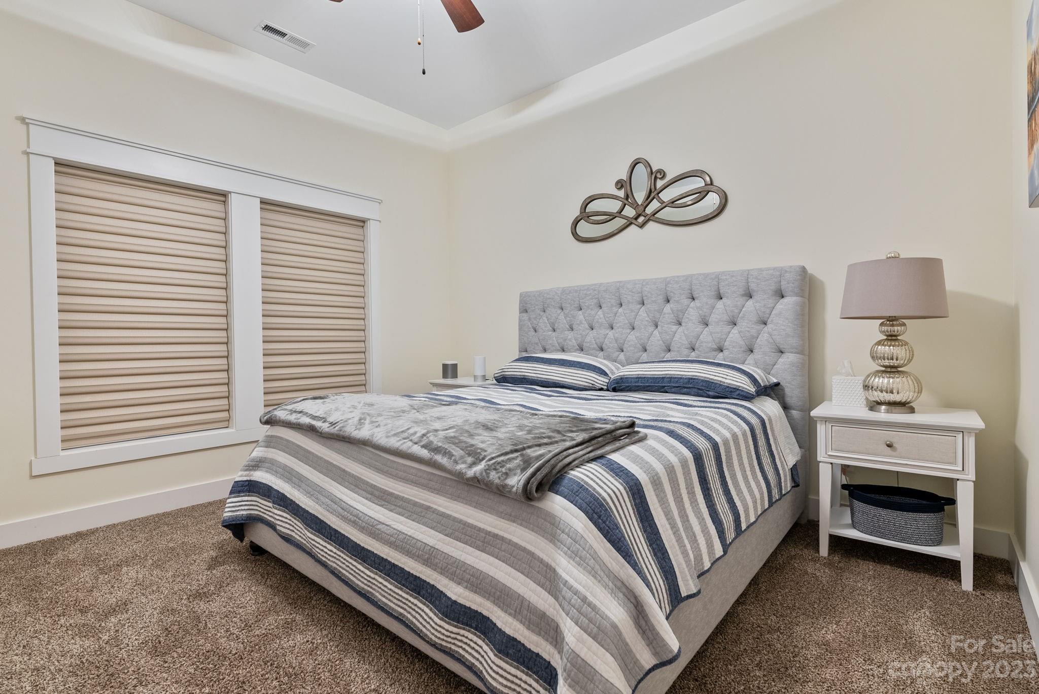 37 Still Creek Loop Fairview, NC 28730 - Photo 27 of 46 a bedroom with a bed and a window