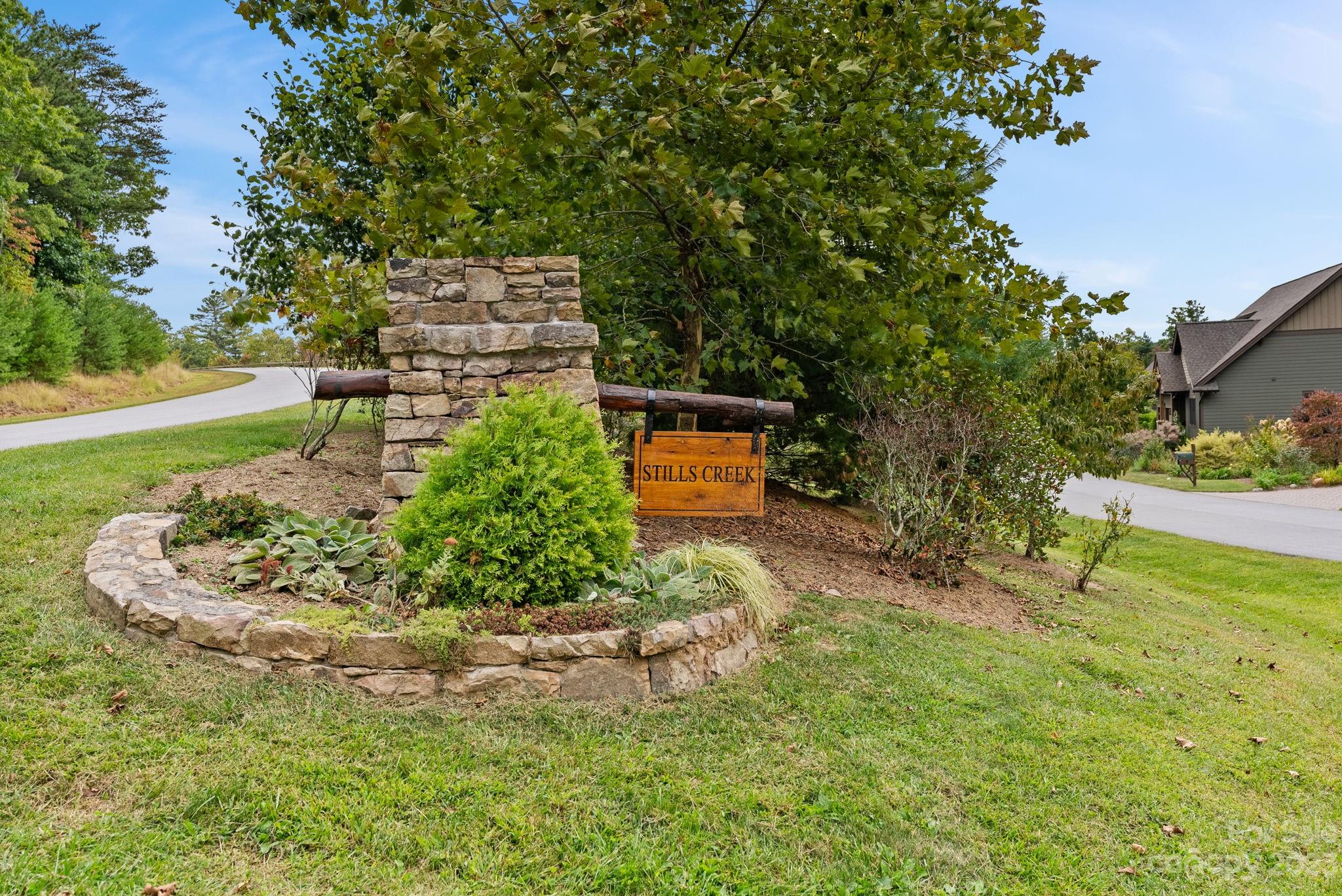 37 Still Creek Loop Fairview, NC 28730 - Photo 34 of 46 a view of a garden with a bench