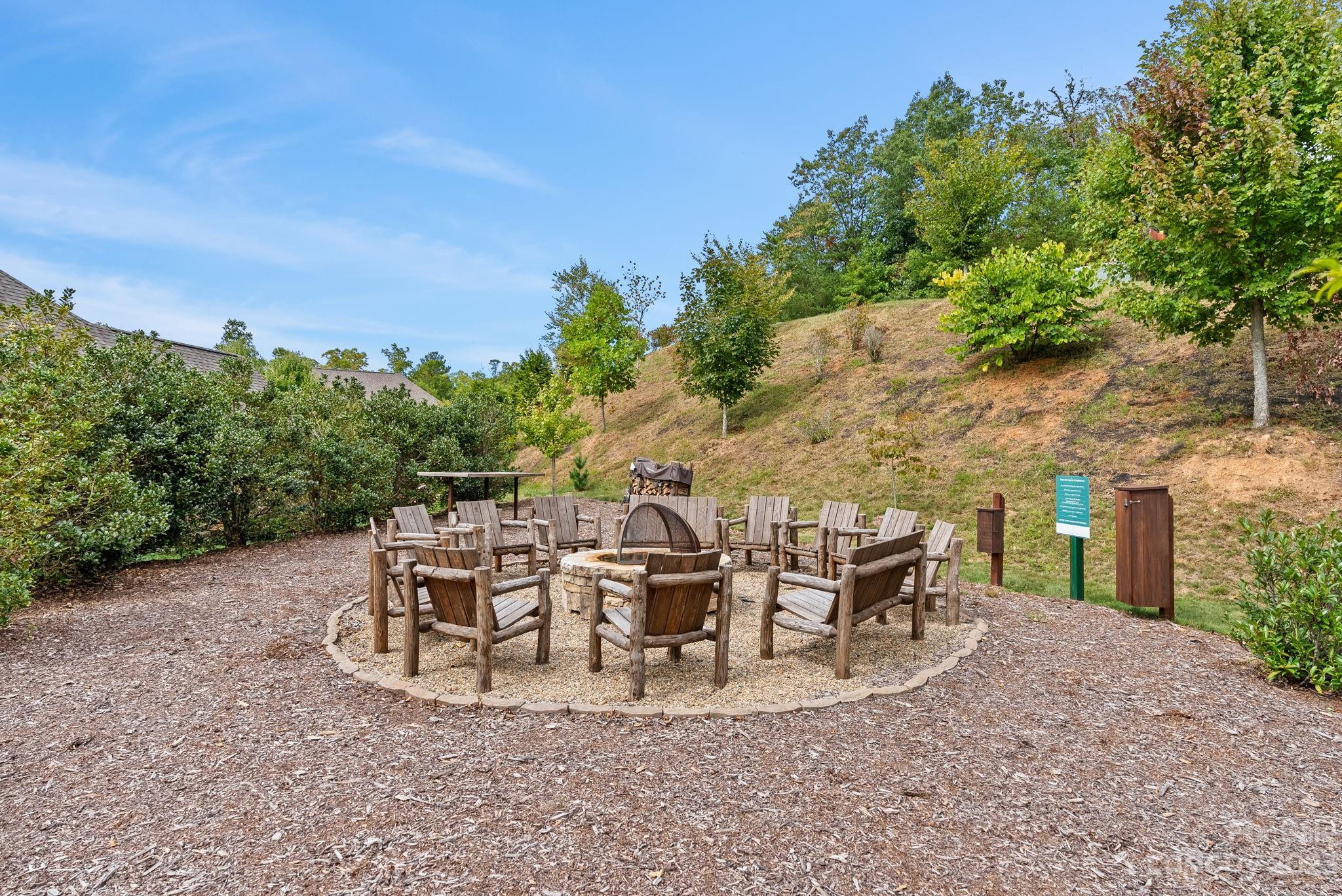 37 Still Creek Loop Fairview, NC 28730 - Photo 35 of 46 a view of a patio with table and chairs and potted plants with large tree