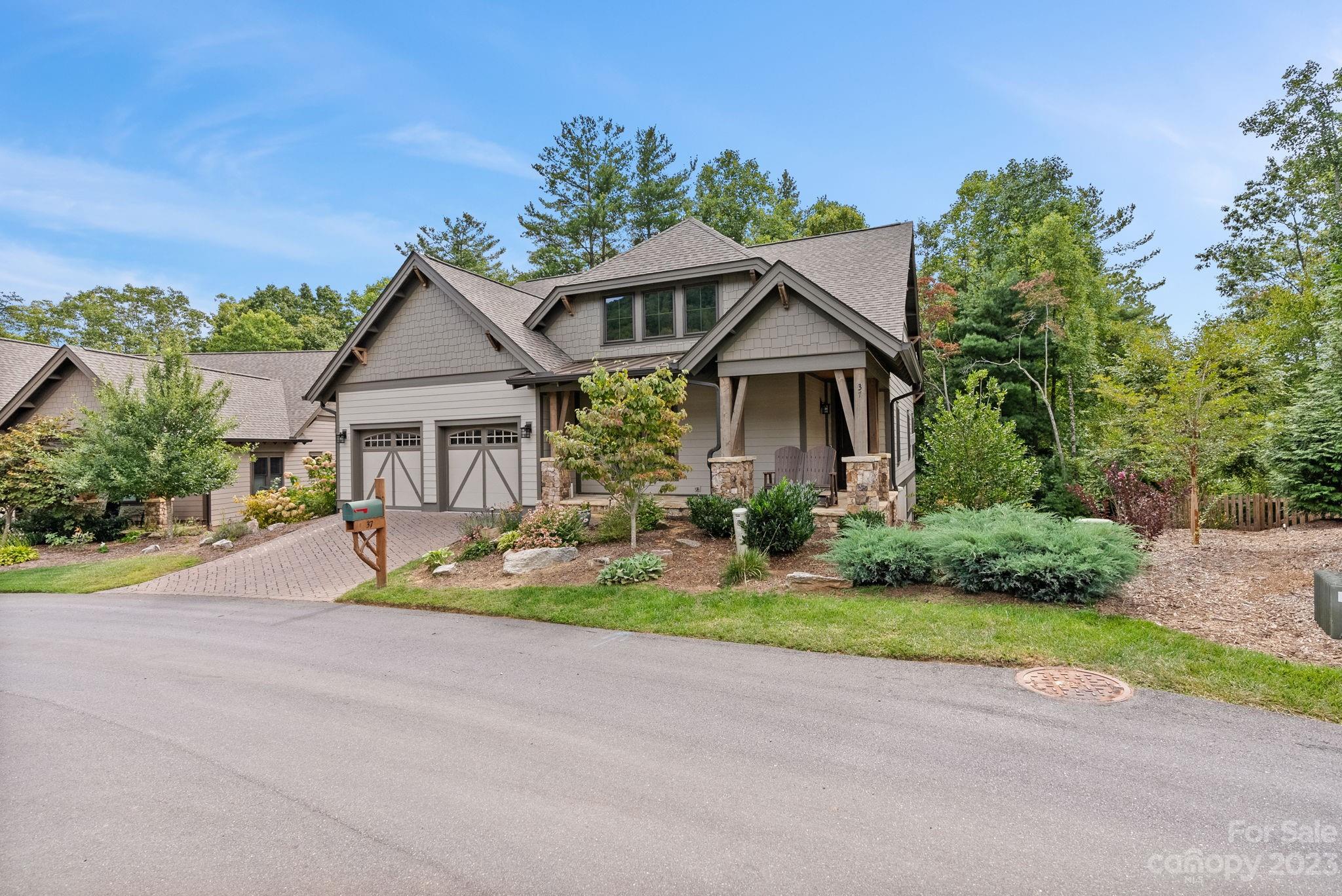 37 Still Creek Loop Fairview, NC 28730 - Photo 45 of 46 a front view of a house with a yard and potted plants