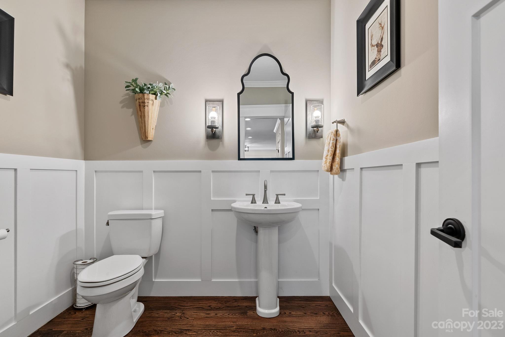 37 Still Creek Loop Fairview, NC 28730 - Photo 9 of 46 a bathroom with a toilet a sink and mirror