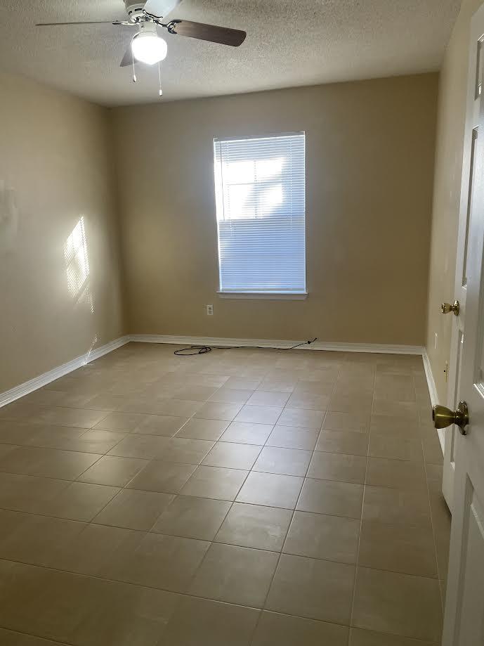 6905 Sea Turtle Circle, Unit E Navarre, FL 32566 - Photo 11 of 14 a view of an empty room with a window