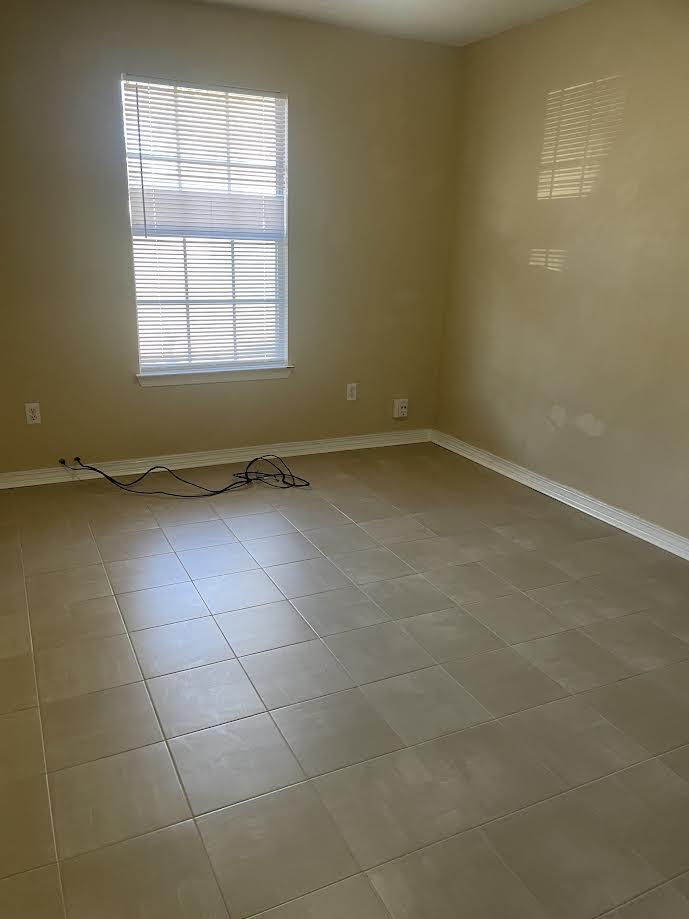 6905 Sea Turtle Circle, Unit E Navarre, FL 32566 - Photo 13 of 14 an empty room with a window