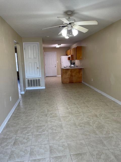 6905 Sea Turtle Circle, Unit E Navarre, FL 32566 - Photo 2 of 14 a view of a kitchen with a sink and a window